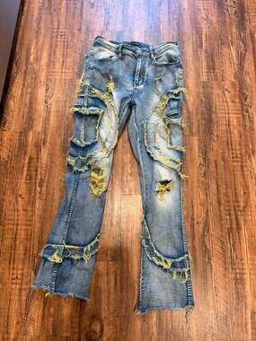Men's Distressed Blue Denim Jeans with Yellow Frayed Accents